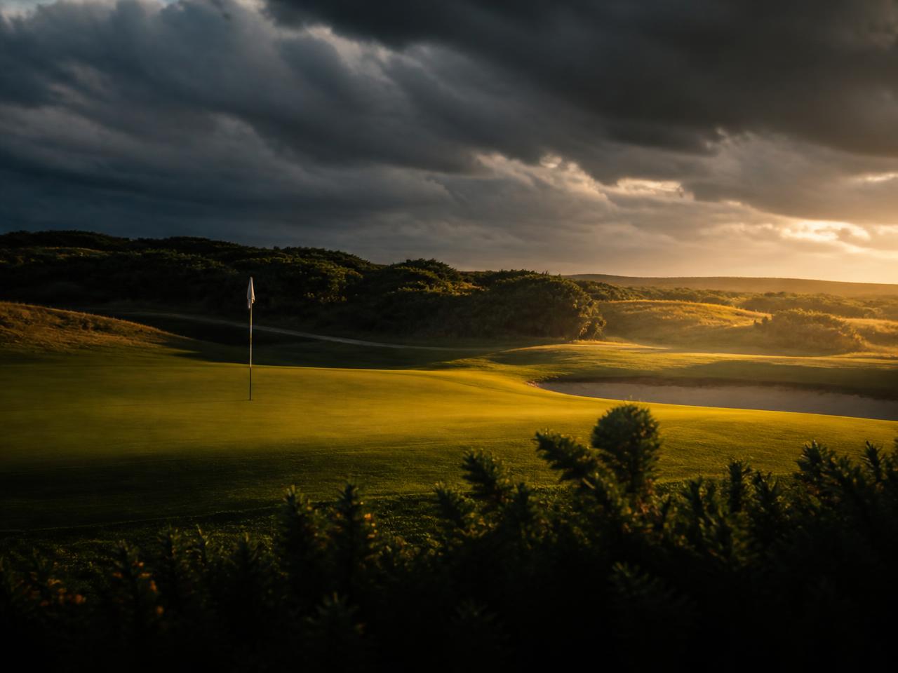 Golf course green at golden hour